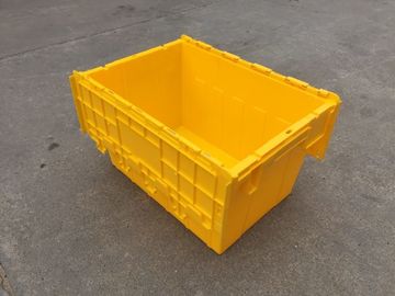 صناديق تخزين بلاستيكية صفراء مرفقة أغطية مكدسة للنقل